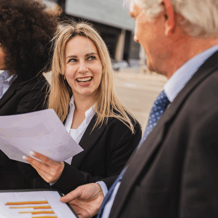 Businesswoman smiling during a discussion with colleagues